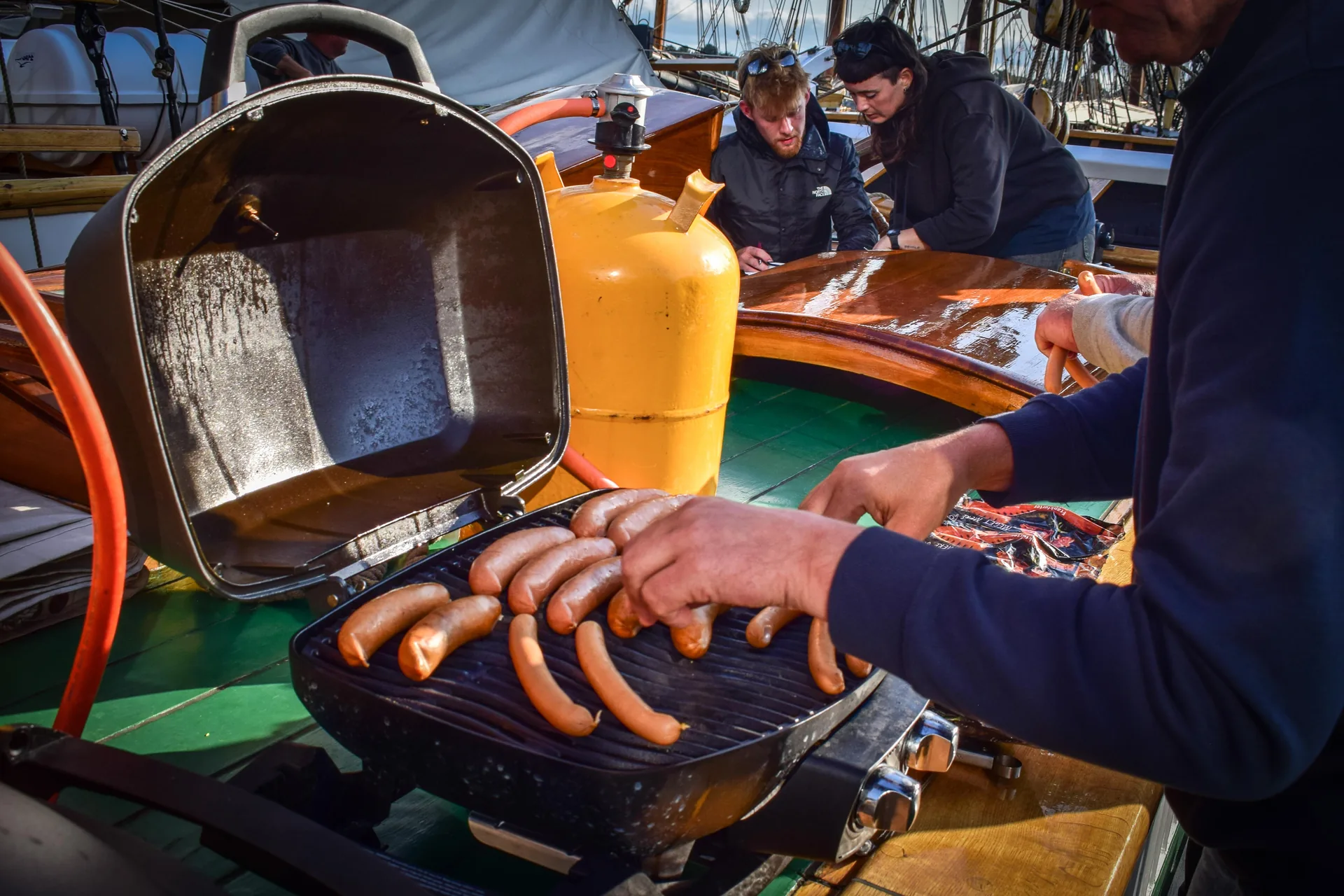 Food being prepared on the grill on Aron's deck